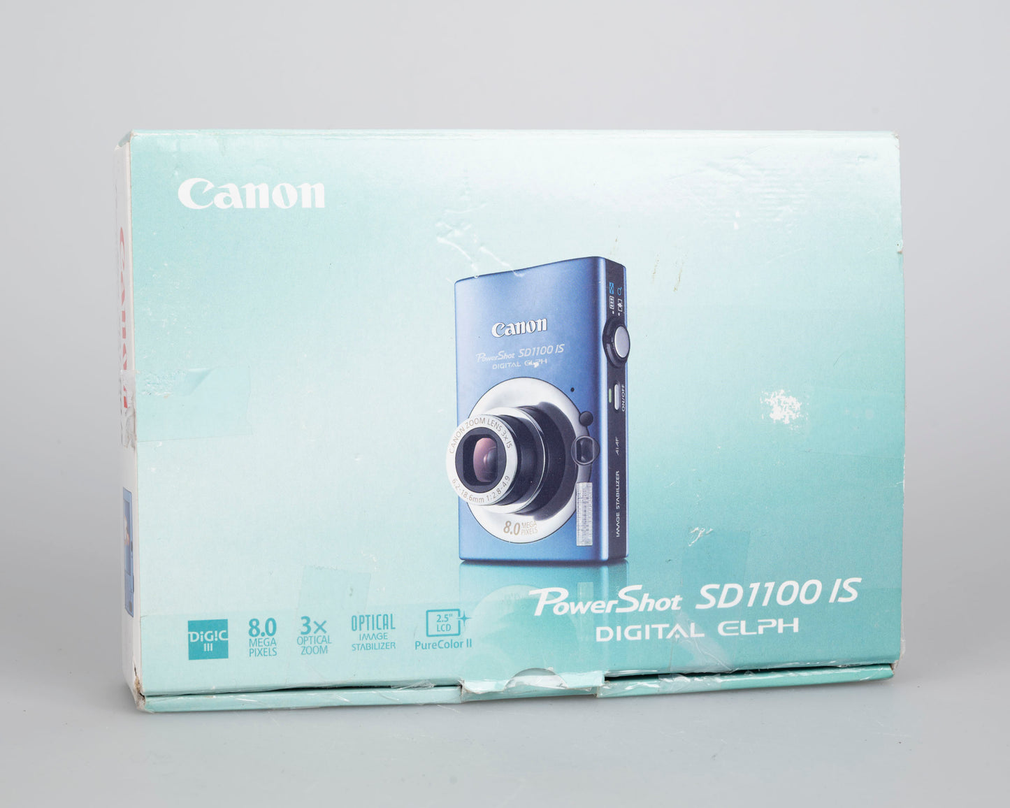 Canon Powershot SD1100 IS Digital Elph 8MP CCD digicam w/ 2GB SD card + batteries + charger + original box + case