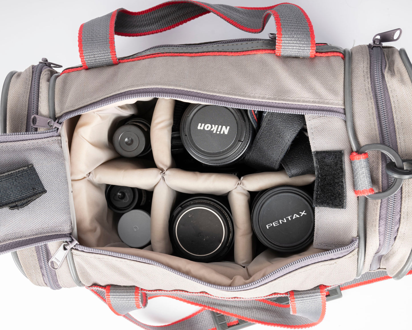 Image mid-sized grey and red camera bag