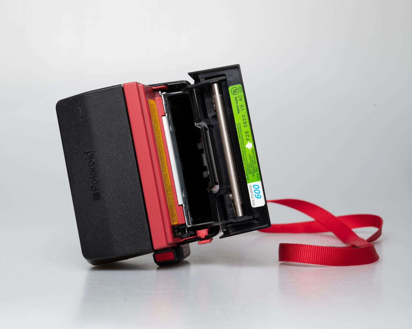 Red Polaroid 600 Cool Cam instant camera (serial F2B0850HVAC)