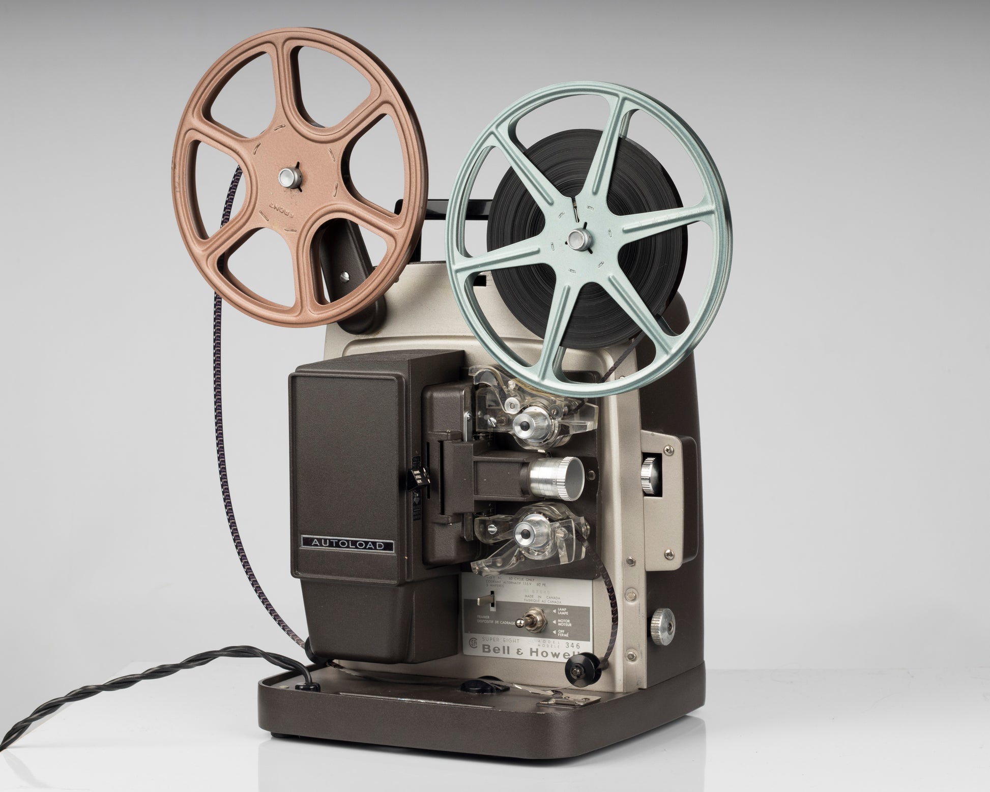 Bell and Howell Model 346 super 8 projector; front angle view with movie reels