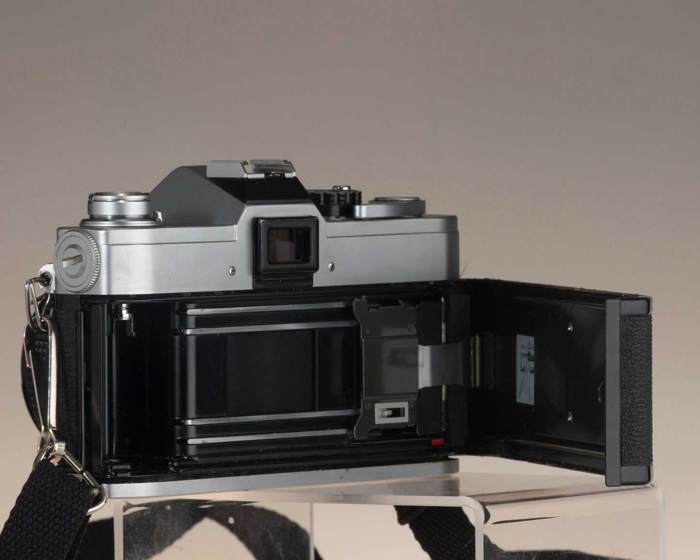 Canon FTb 35mm SLR camera with Canon FD 1:1.8 lens. Open back.