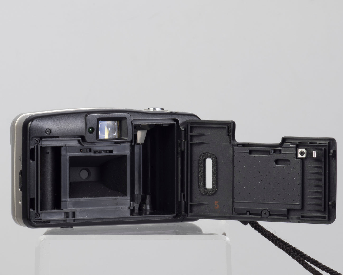 The Minolta AF50 Big Finder is an ultra-compact 35mm film camera from the 1990s (film door open)