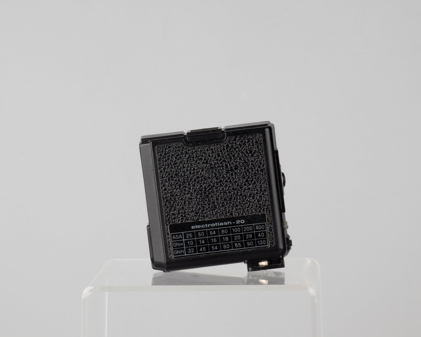 Minolta Hi-Matic 7SII 35mm rangefinder camera with half-case and Minolta 20 flash