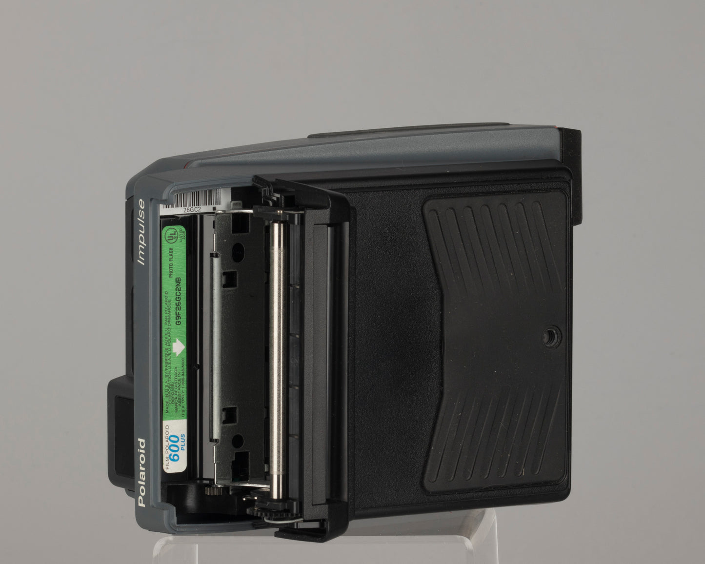 Polaroid Impulse instant camera with original case, prism lens filter, box, and manual