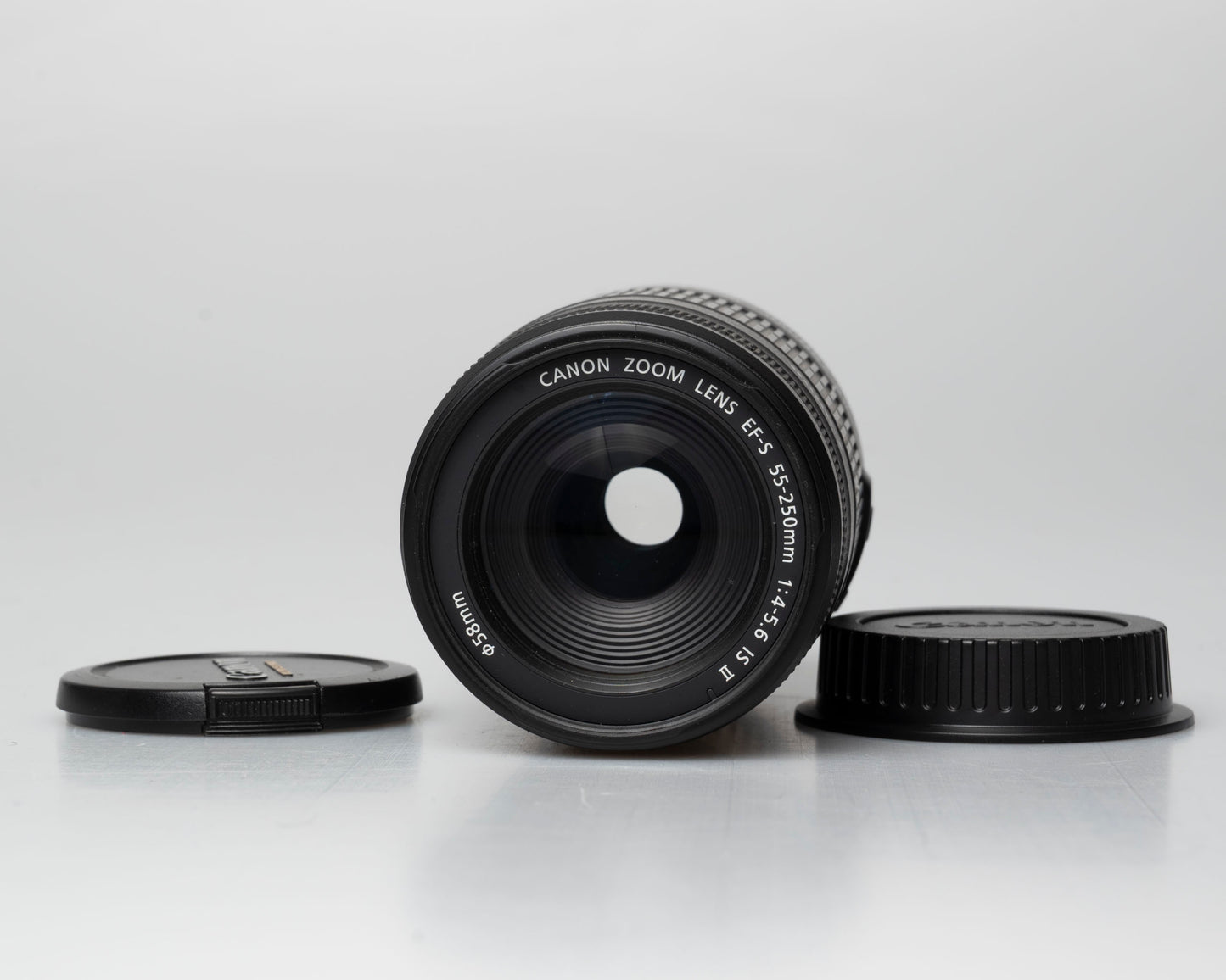 Canon EF-S 55-250mm f/4-5.6 IS II lens, front view with front and back caps off