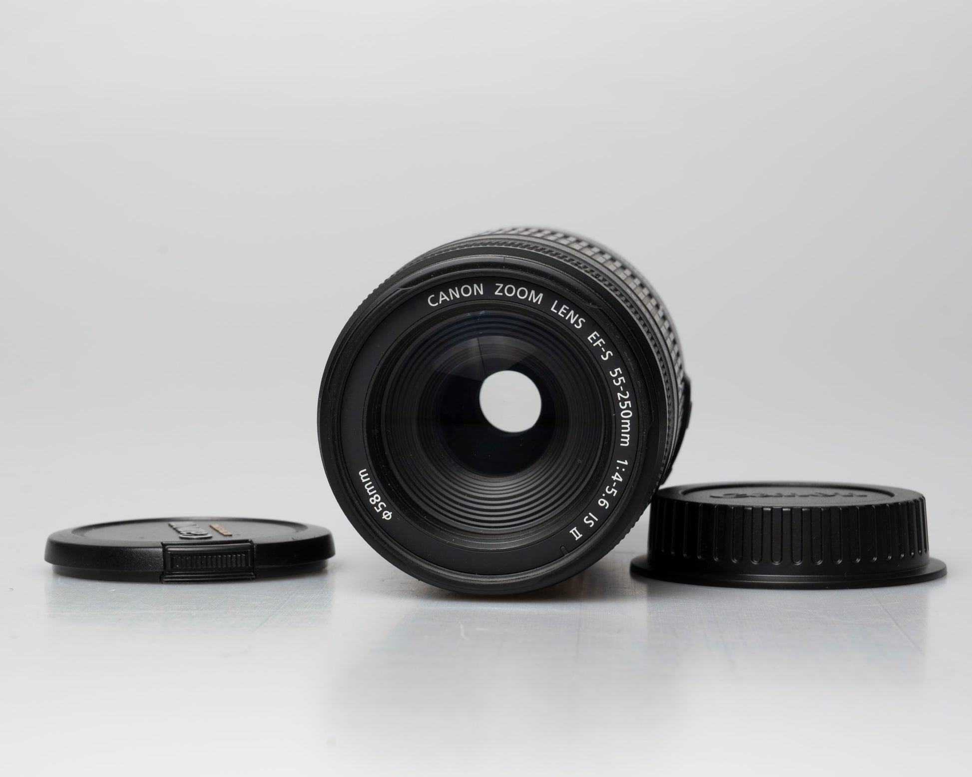 Canon EF-S 55-250mm f/4-5.6 IS II lens, front view with front and back caps off