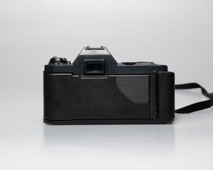 Canon T50 35mm film SLR camera w/FD 50mm f1.8 lens (serial 1316532)