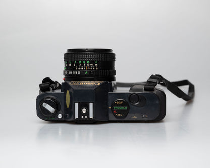 Canon T50 35mm film SLR camera w/FD 50mm f1.8 lens (serial 1316532)