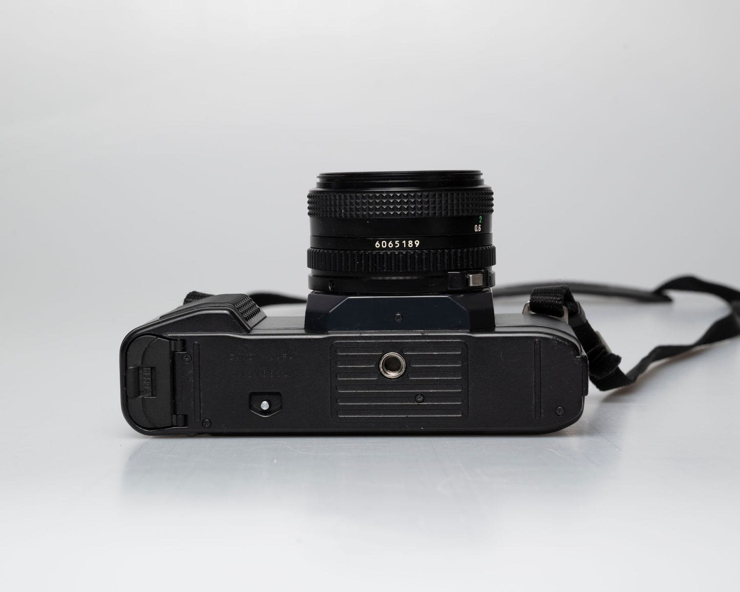 Canon T50 35mm film SLR camera w/FD 50mm f1.8 lens (serial 1316532)