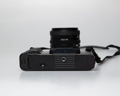 Canon T50 35mm film SLR camera w/FD 50mm f1.8 lens (serial 1316532)