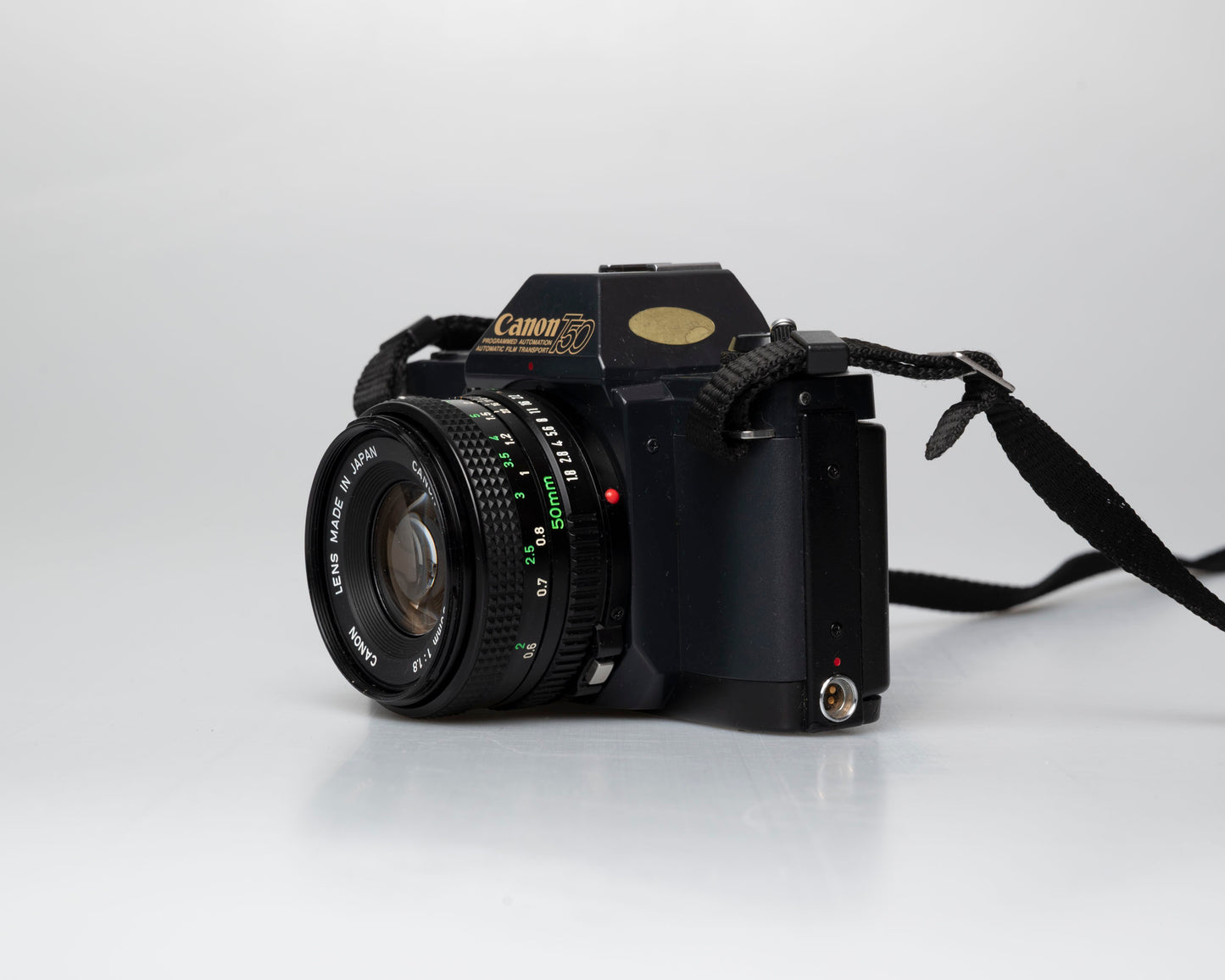 Canon T50 35mm film SLR camera w/FD 50mm f1.8 lens (serial 1316532)