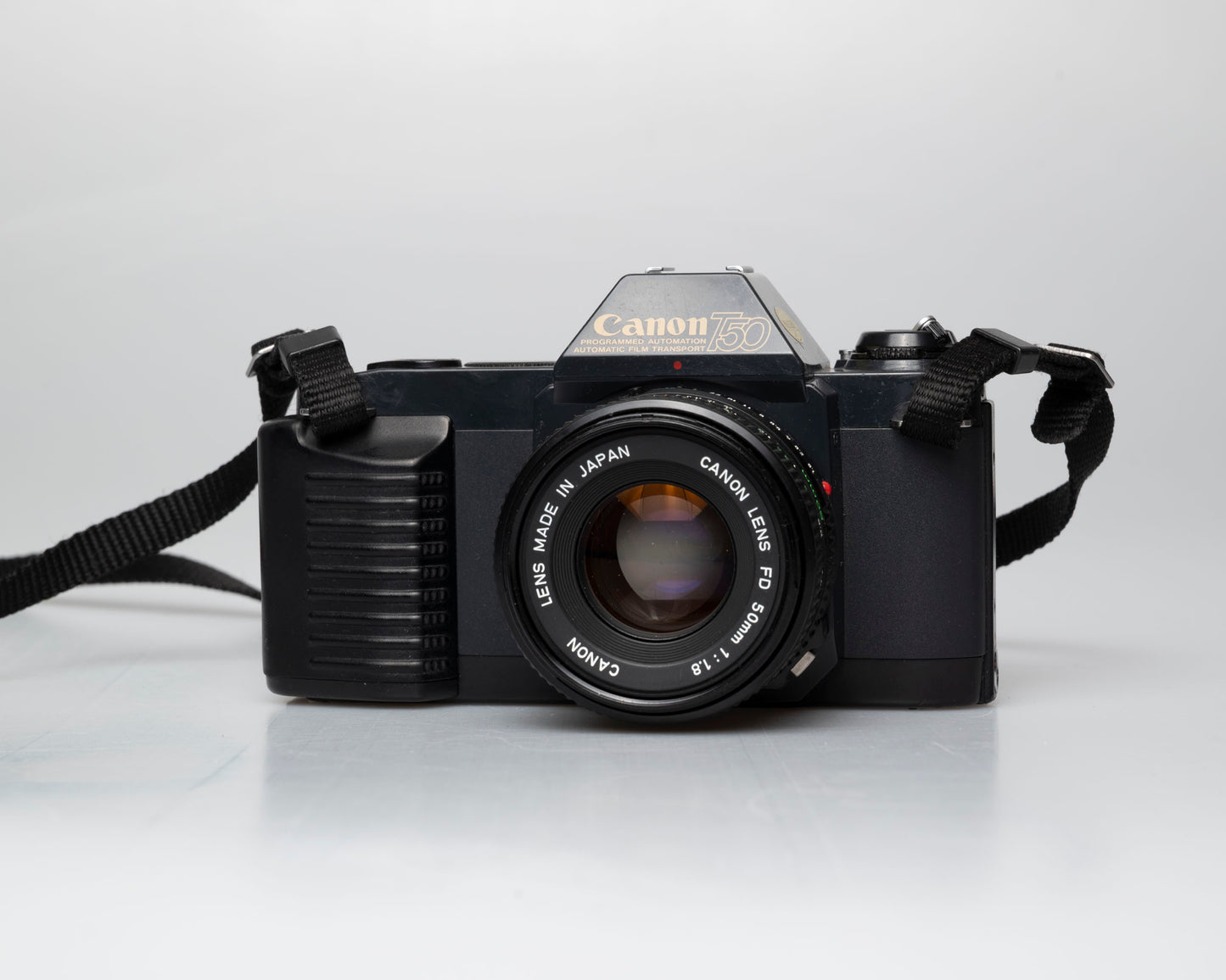 Canon T50 35mm film SLR camera w/FD 50mm f1.8 lens (serial 1316532)