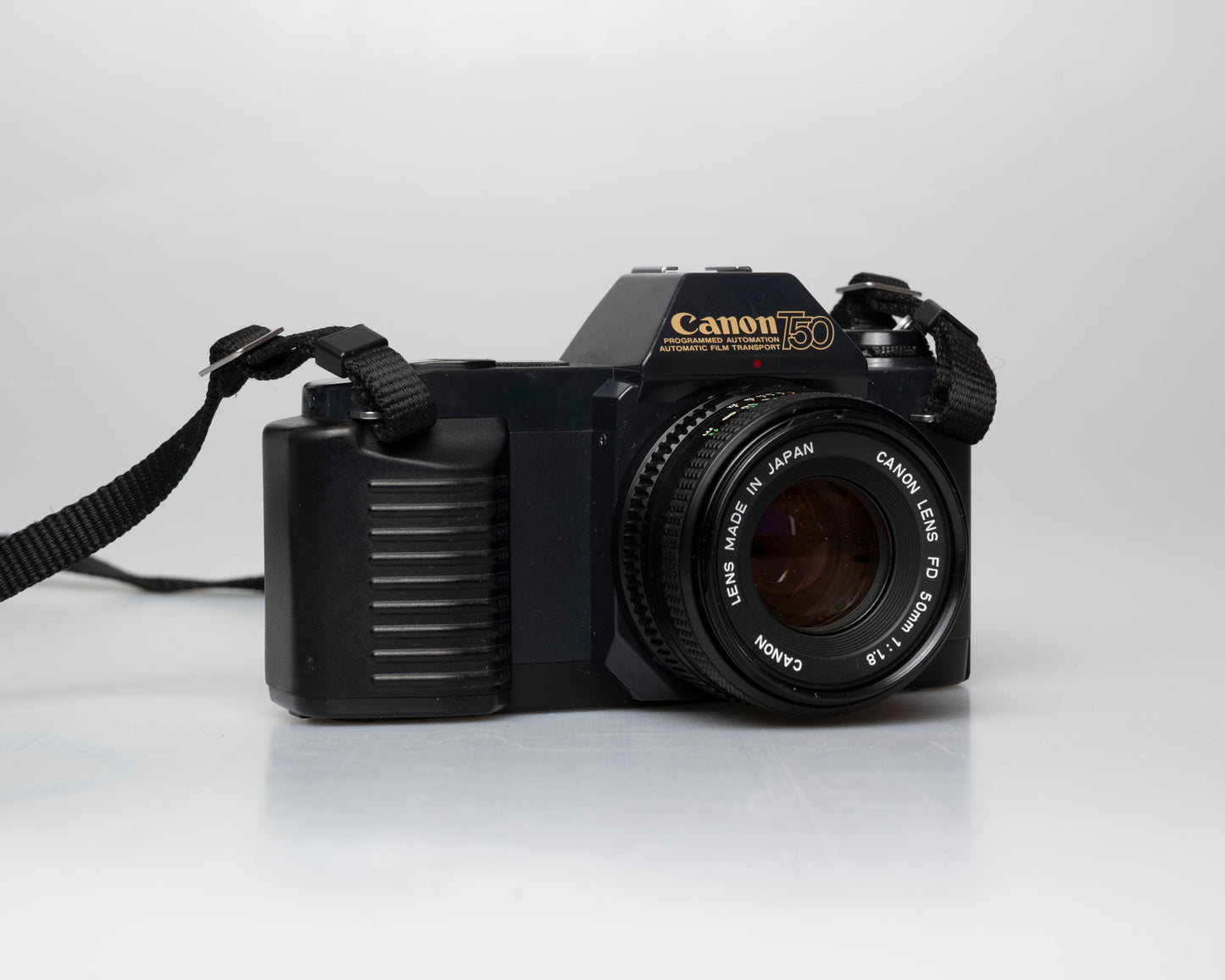 Canon T50 35mm film SLR camera w/FD 50mm f1.8 lens (serial 1316532)