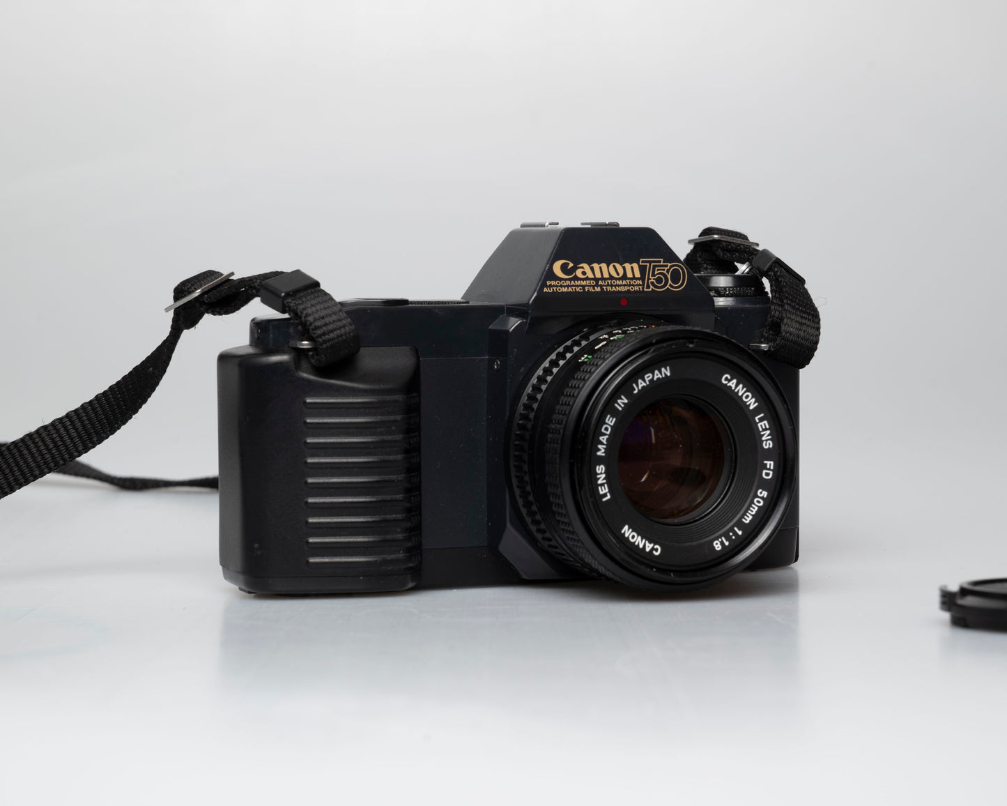 Canon T50 35mm film SLR camera w/FD 50mm f1.8 lens (serial 1316532)