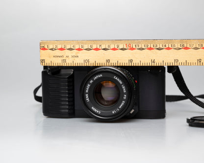 Canon T50 35mm film SLR camera w/FD 50mm f1.8 lens (serial 1316532)