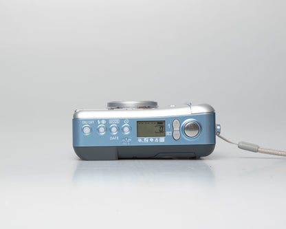 The Canon Sure Shot 115U II ultra-compact 35mm film camera; top view showing buttons; available for purchase at www.newwavepool.shop