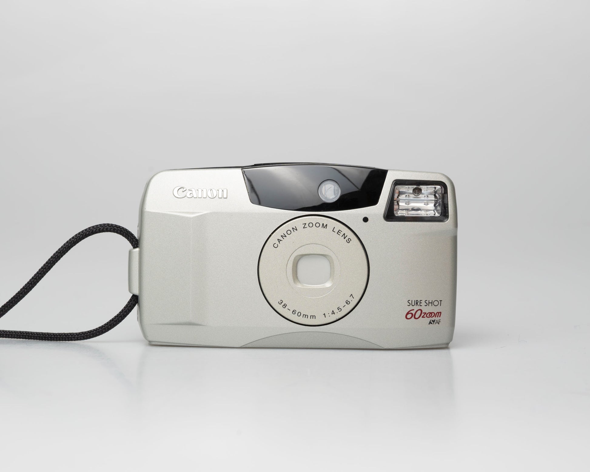 Canon Sure Shot 60 Zoom 35mm point-and-shoot camera; front view lens cover closed (off)