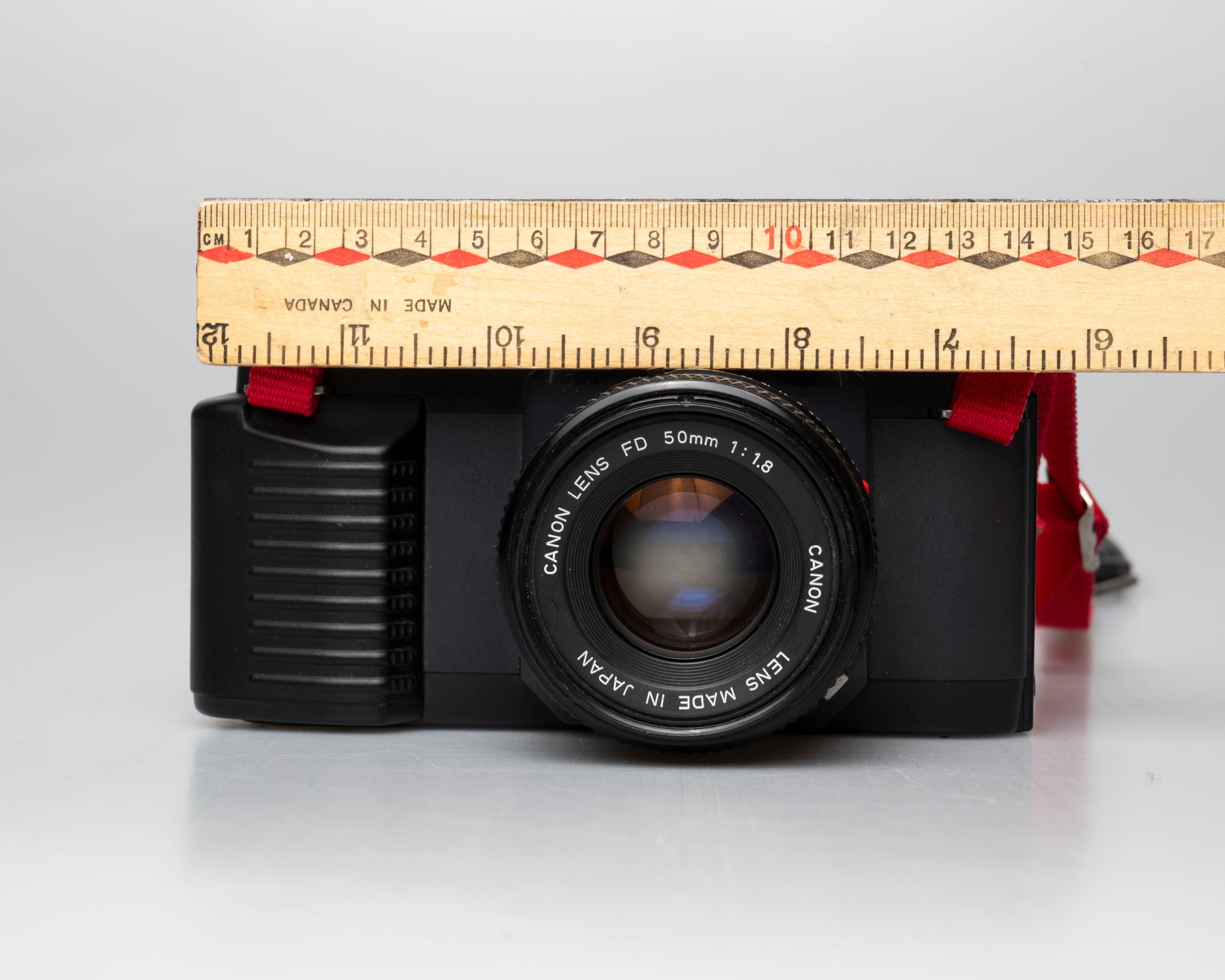 Canon T50 front view with ruler for scale