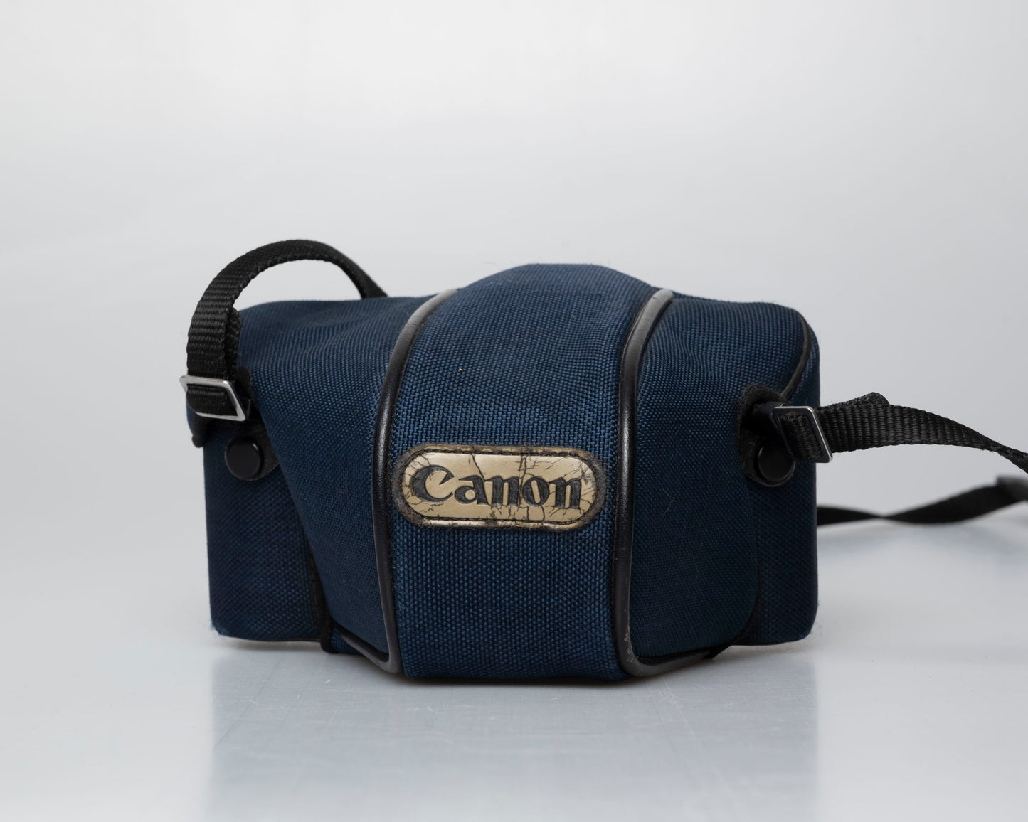 Canon T50 35mm film SLR camera w/ FD 35-70mm lens + Speedlite 277T flash + ever-ready case (serial 1061065)