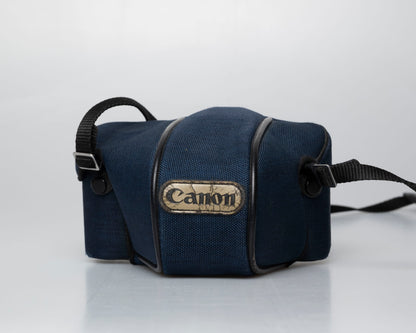 Canon T50 35mm film SLR camera w/ FD 35-70mm lens + Speedlite 277T flash + ever-ready case (serial 1061065)