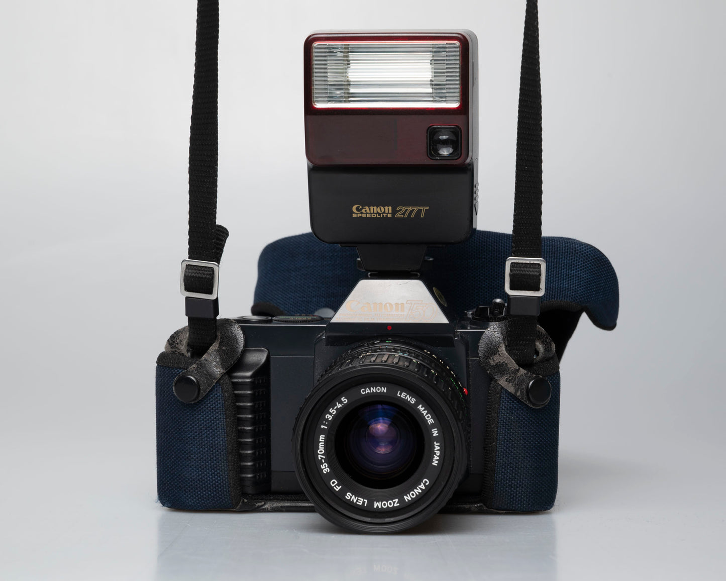 Canon T50 35mm film SLR camera w/ FD 35-70mm lens + Speedlite 277T flash + ever-ready case (serial 1061065)