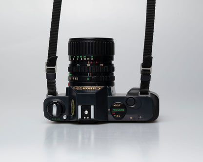 Canon T50 35mm film SLR camera w/ FD 35-70mm lens + Speedlite 277T flash + ever-ready case (serial 1061065)