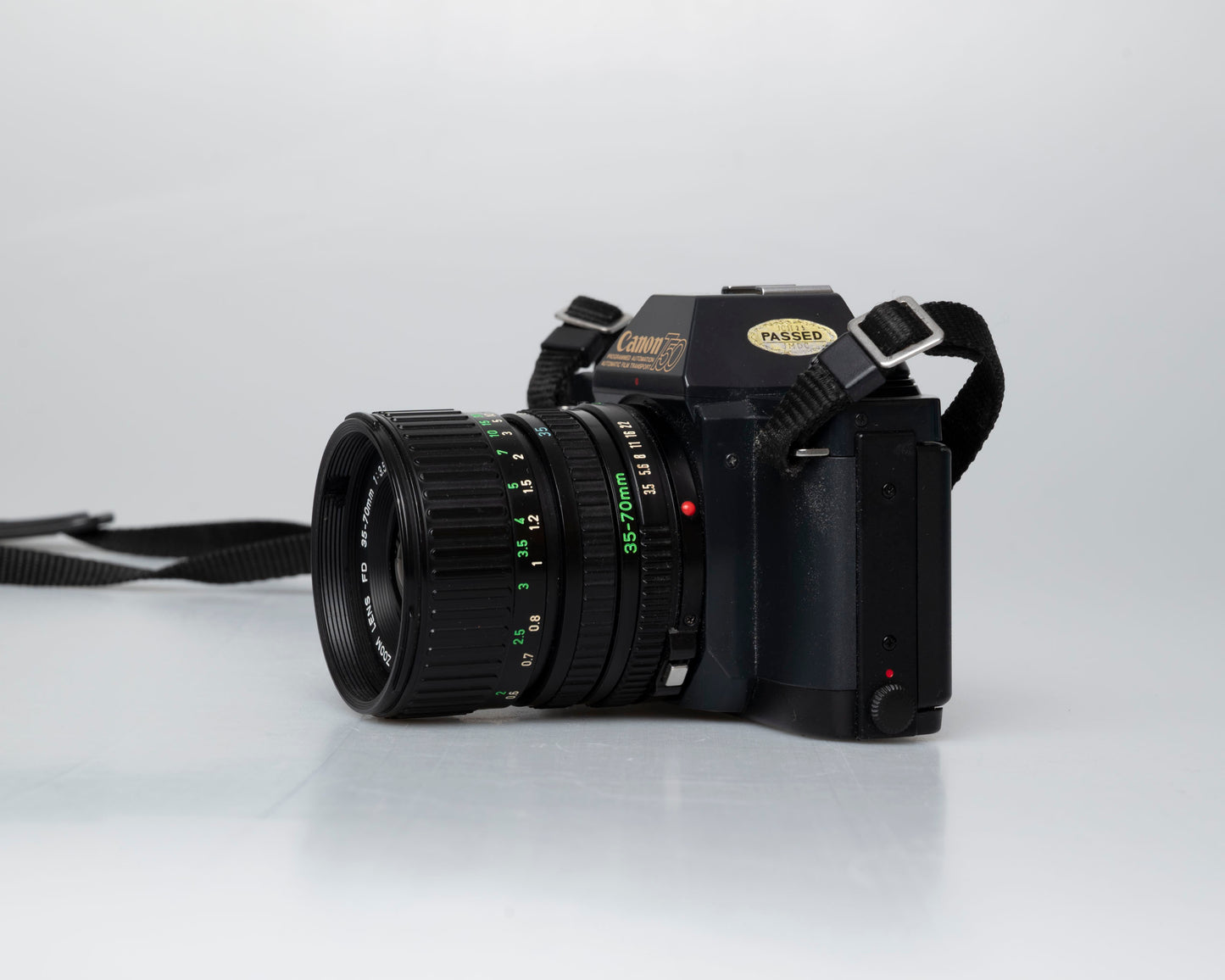 Canon T50 35mm film SLR camera w/ FD 35-70mm lens + Speedlite 277T flash + ever-ready case (serial 1061065)