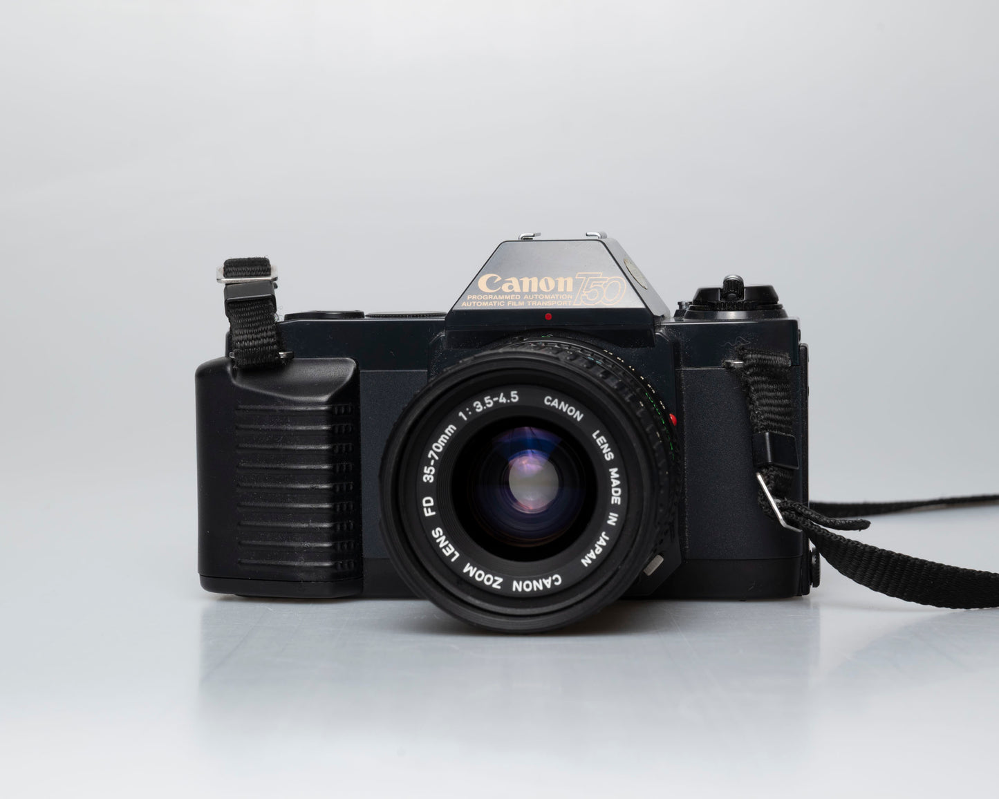 Canon T50 35mm film SLR camera w/ FD 35-70mm lens + Speedlite 277T flash + ever-ready case (serial 1061065)