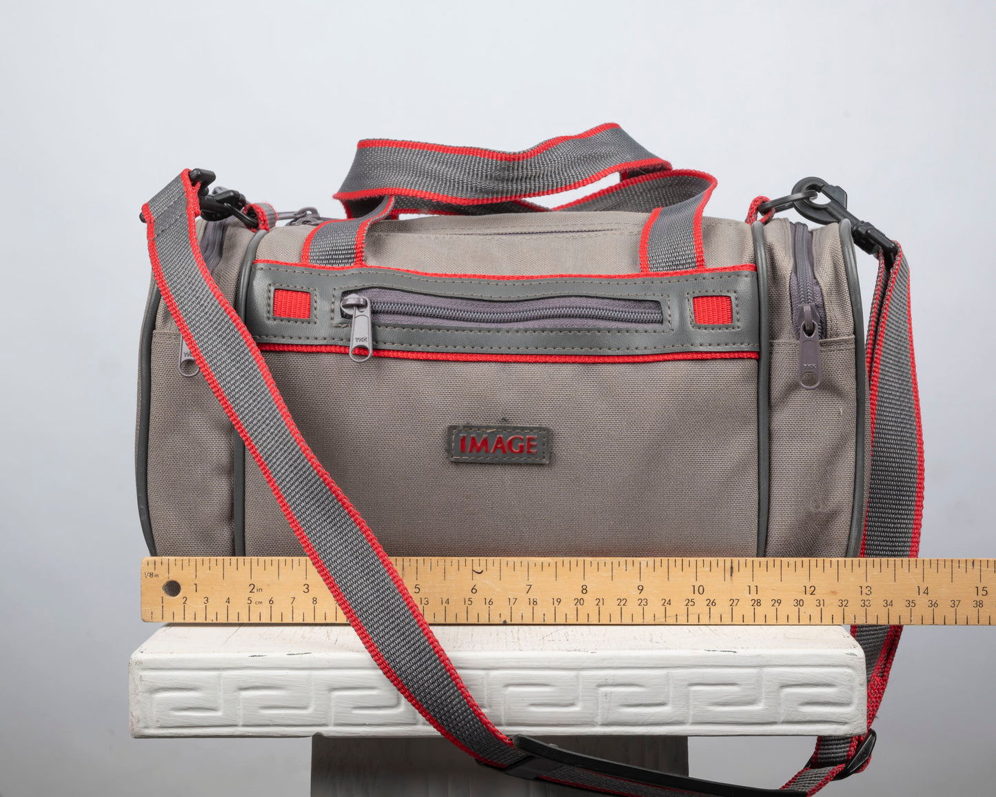 Image mid-sized grey and red camera bag