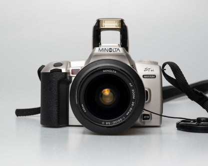 Minolta STsi 35mm SLR film camera; front view pop-up flash open
