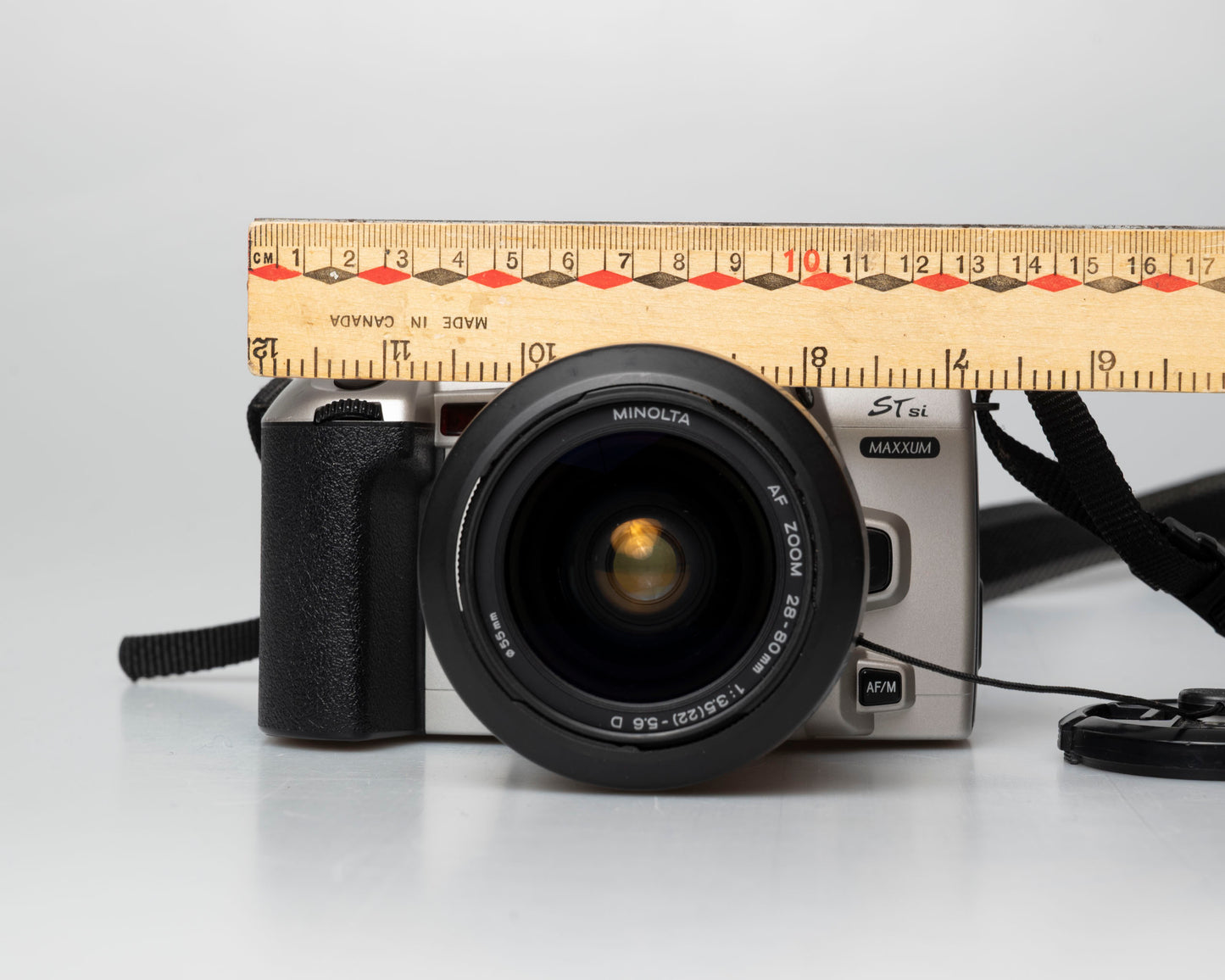 Minolta STsi 35mm SLR film camera; front view with ruler for scale