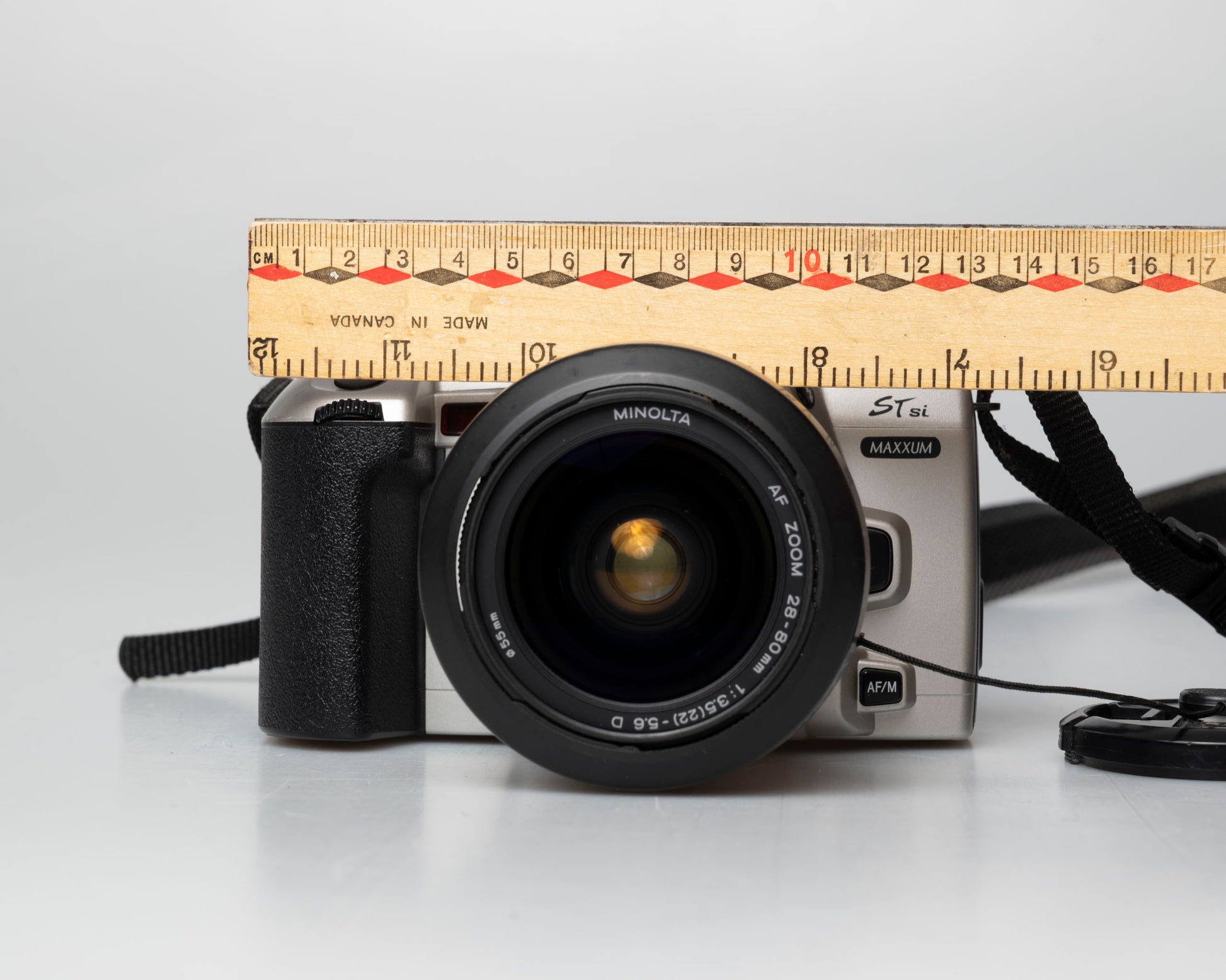Minolta STsi 35mm SLR film camera; front view with ruler for scale