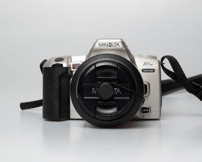 Minolta STsi 35mm SLR film camera; front view with lens cap