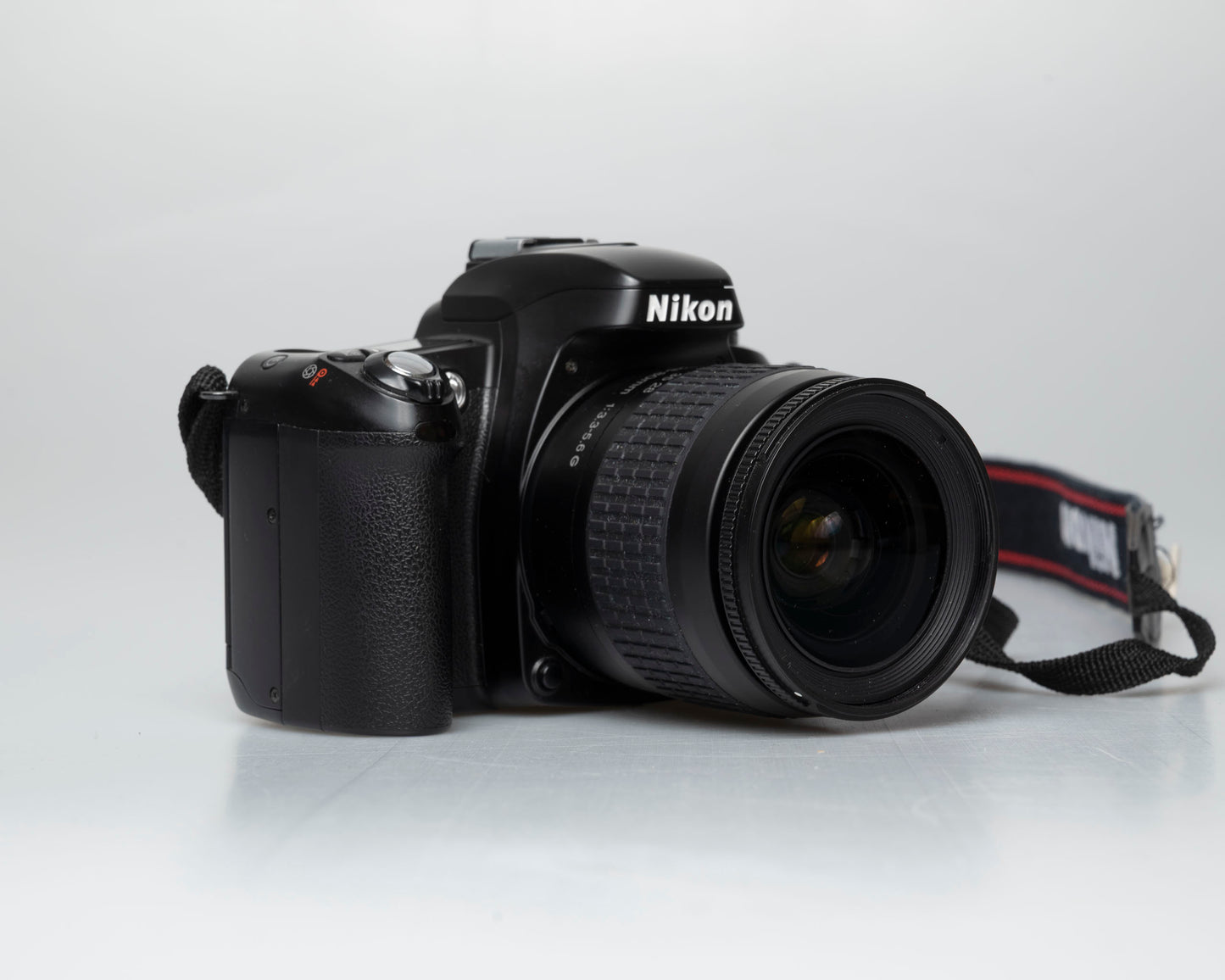 Nikon F75 35mm film SLR w/ AF Nikkor 28-80mm lens (serial 2258155)