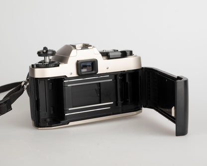 Nikon FE10 35mm film SLR camera w/ Zoom-Nikkor 35-70mm lens + ever-ready case (serial 2001252)