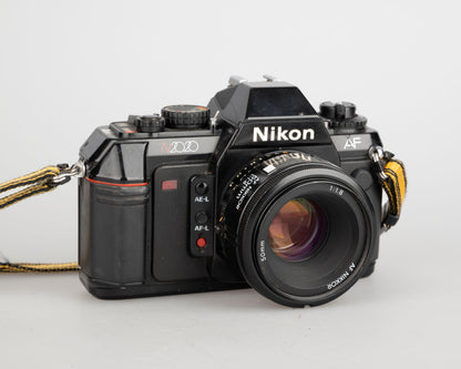 Nikon N2020 35mm film SLR w/ AF Nikkor 50mm f1.8 lens (serial 5387168)
