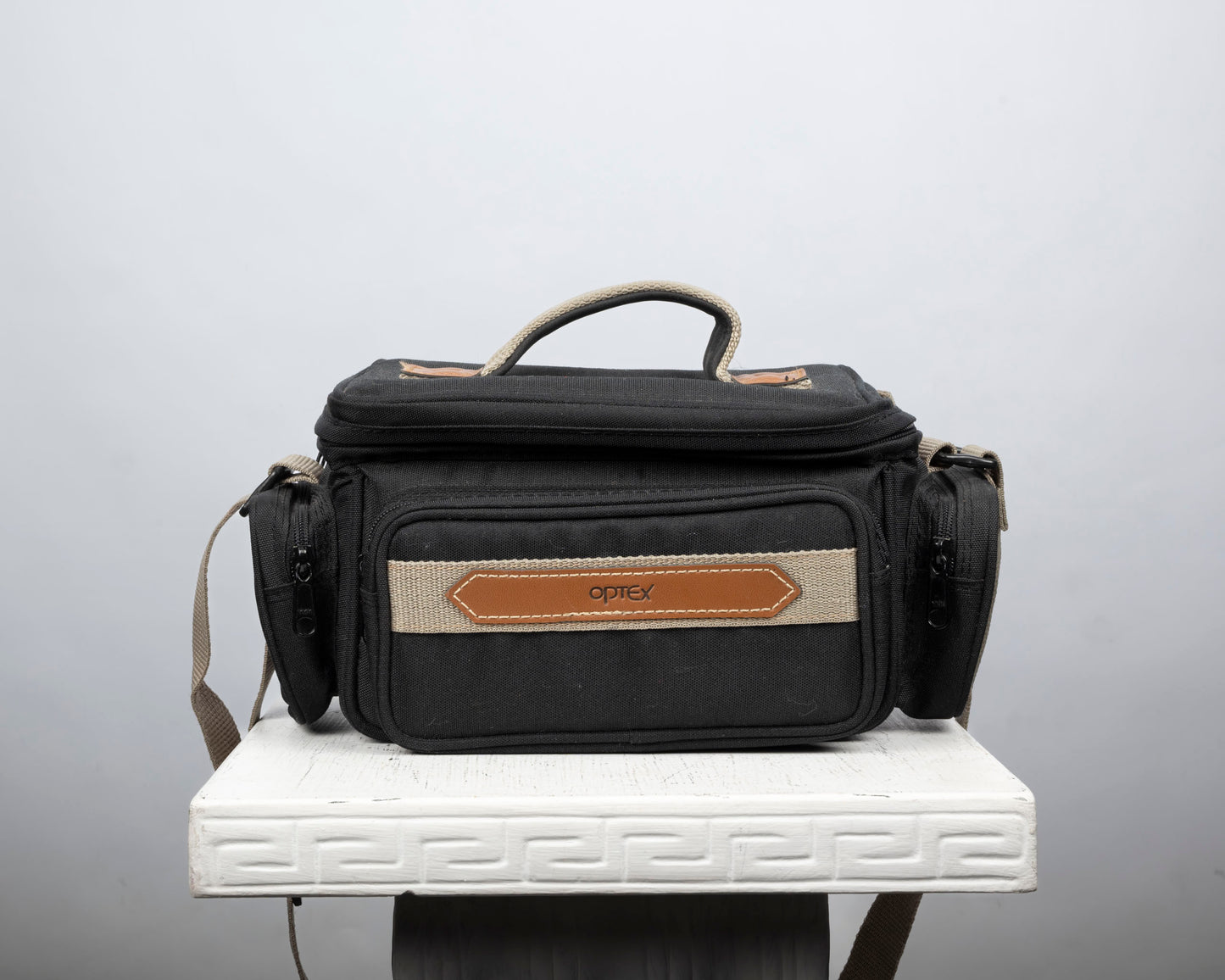 Optex mid-sized black and tan camera bag