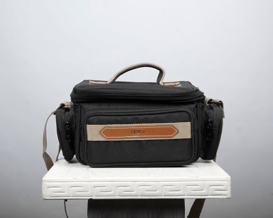 Optex mid-sized black and tan camera bag