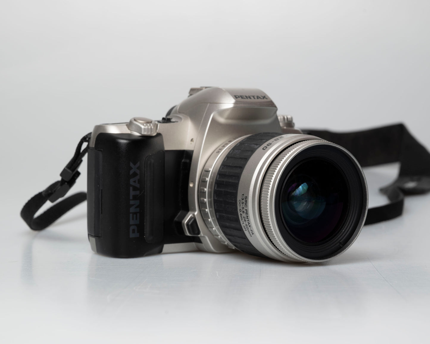 Pentax MZ-50 35mm film camera with kit zoom lens; front view angled