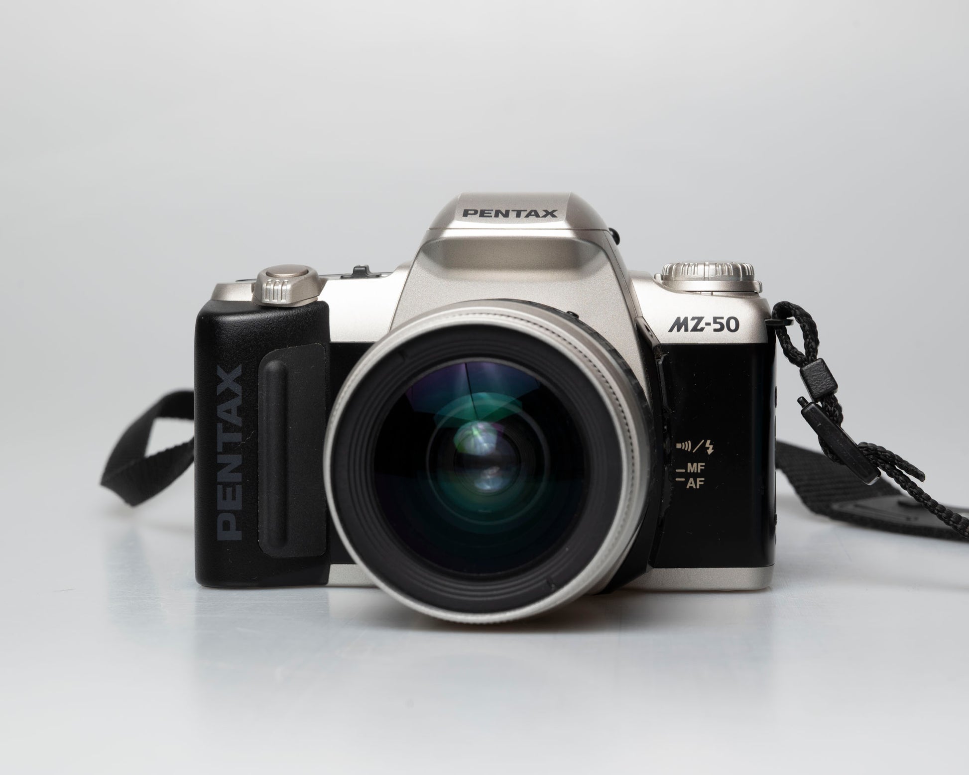 Pentax MZ-50 35mm film camera with kit zoom lens; front view