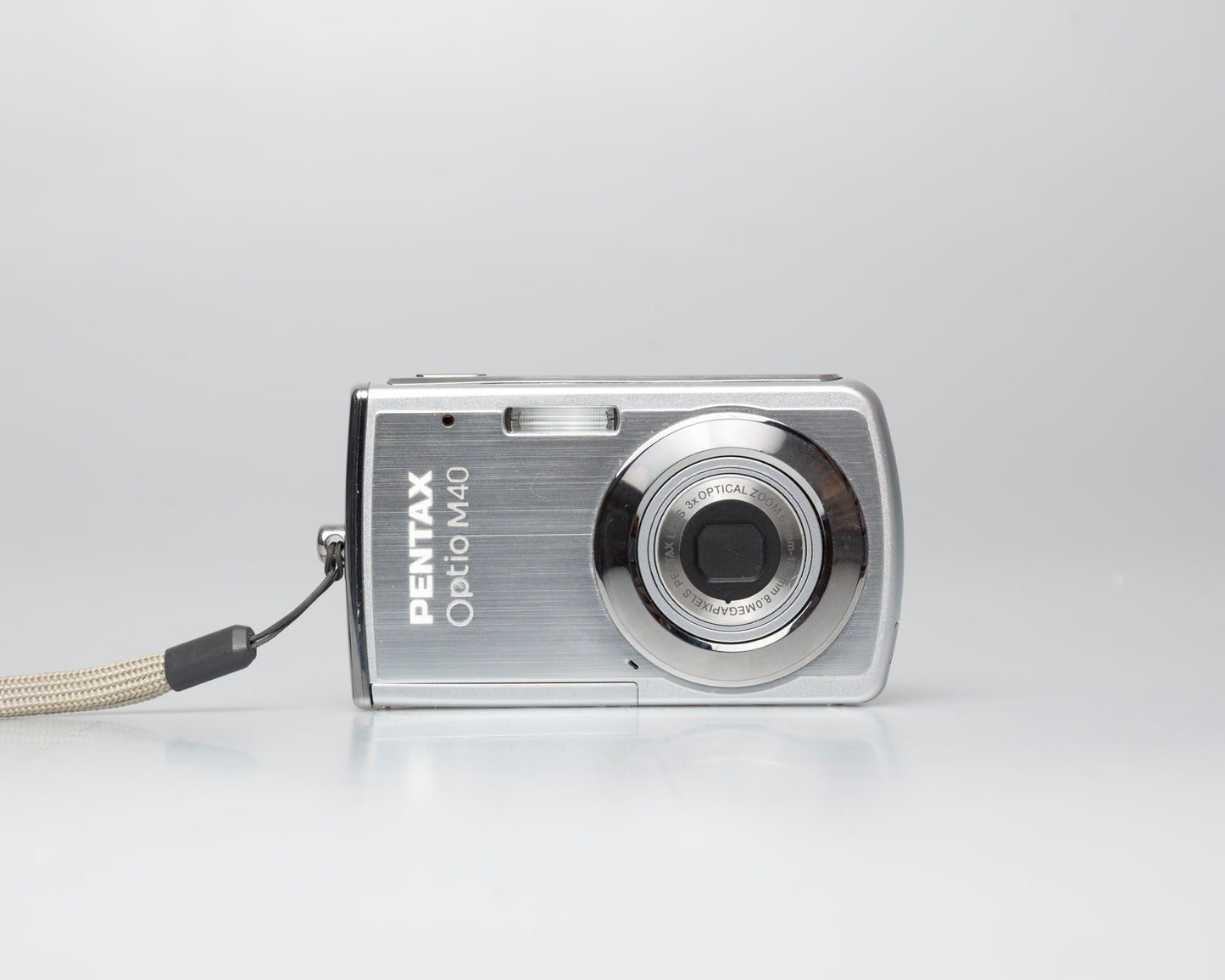 Pentax Optio M40 8 megapixel digicam w/ 8GB SD card + battery + charger (serial 9303499)