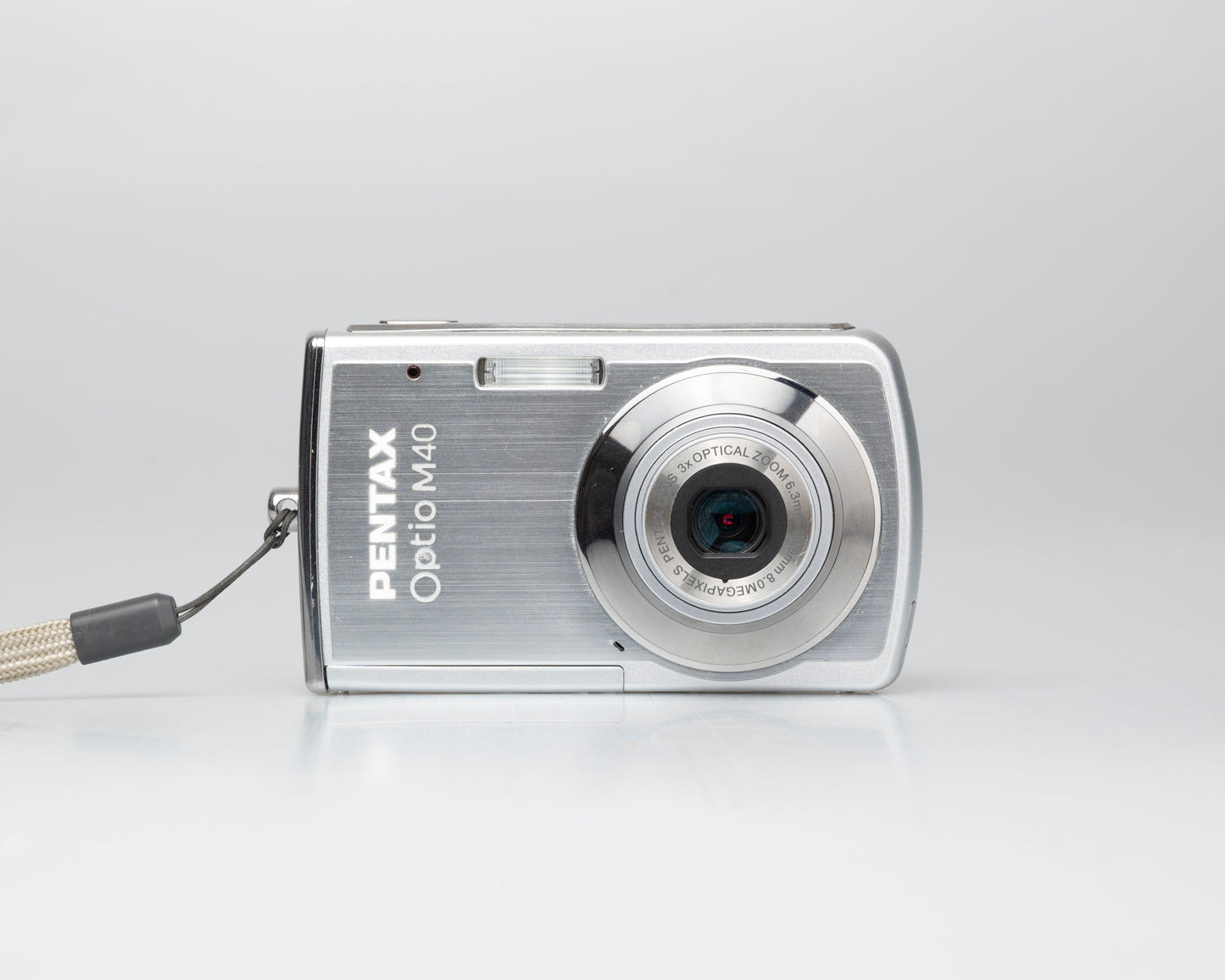 Pentax Optio M40 8 megapixel digicam w/ 8GB SD card + battery + charger (serial 9303499)