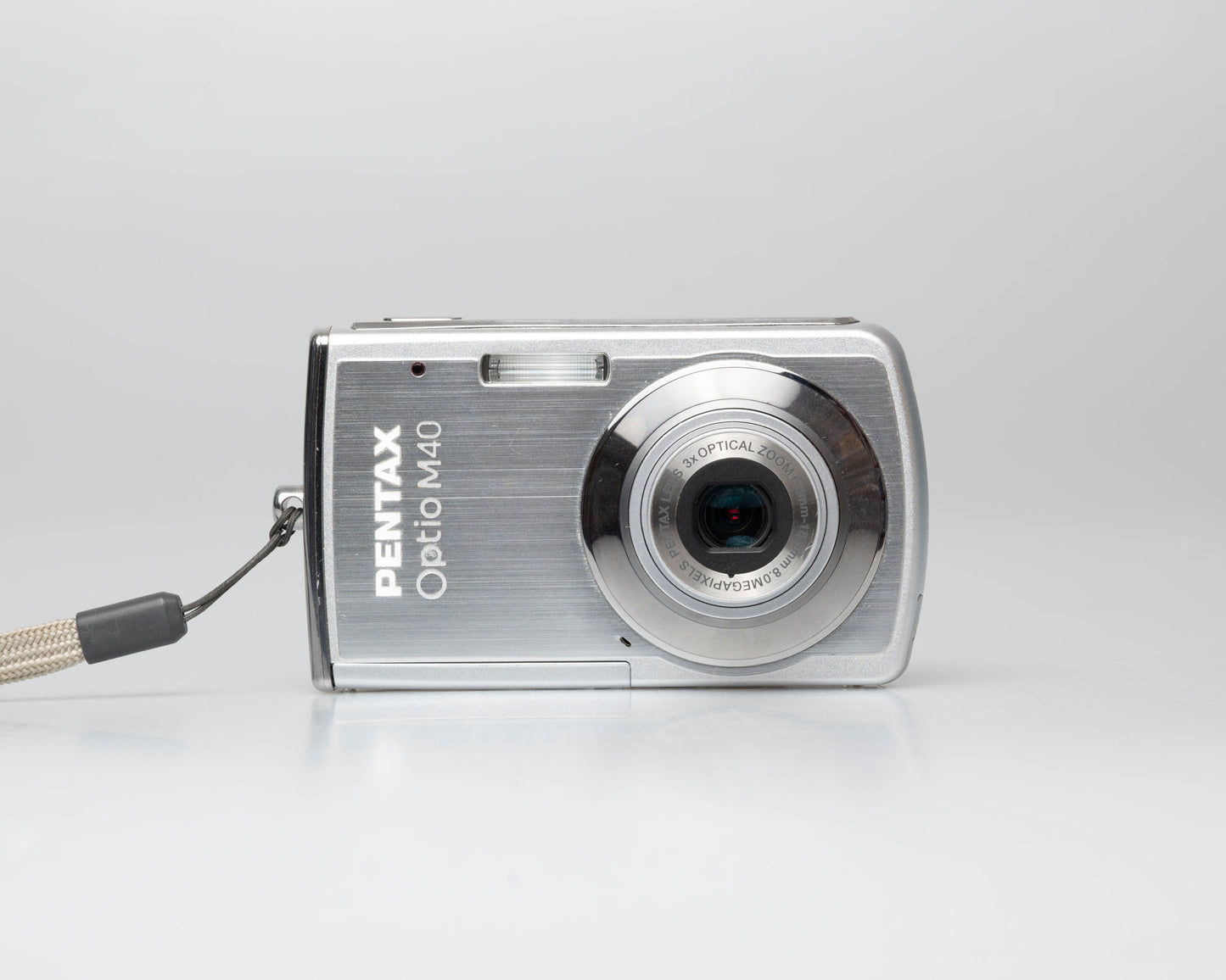 Pentax Optio M40 8 megapixel digicam w/ 8GB SD card + battery + charger (serial 9303499)