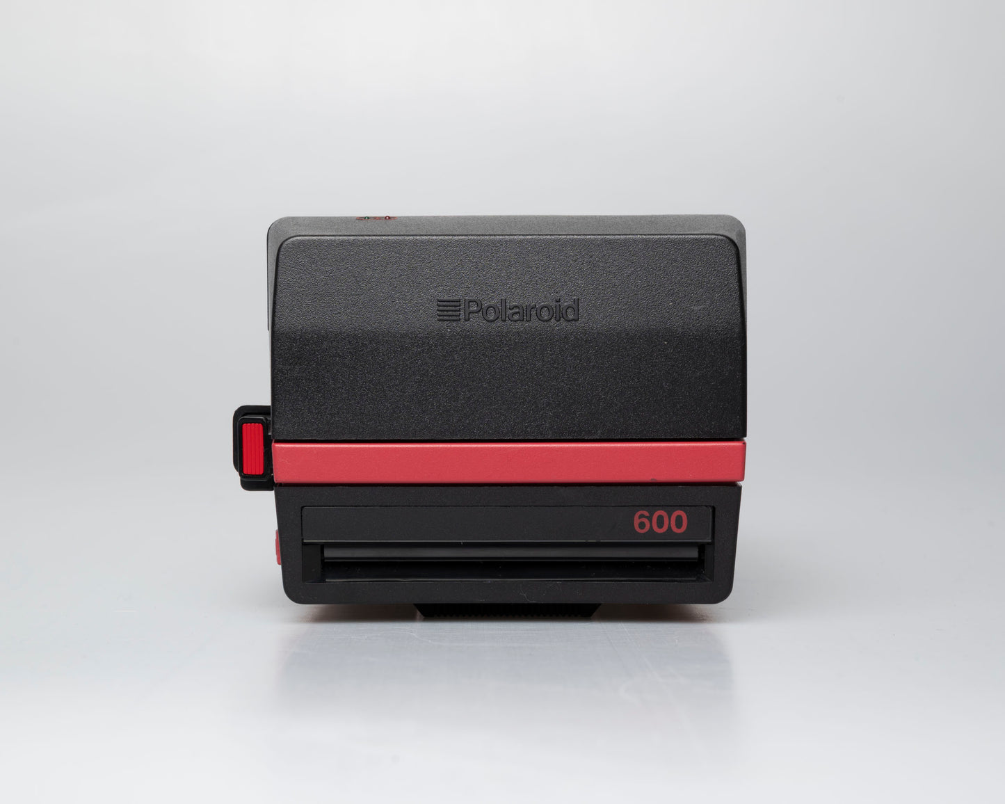 Red Polaroid 600 Cool Cam instant camera (serial F2B0850HVAC)