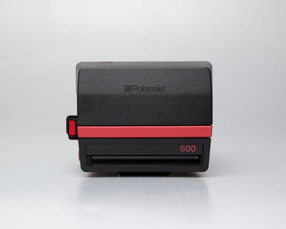 Red Polaroid 600 Cool Cam instant camera (serial F2B0850HVAC)
