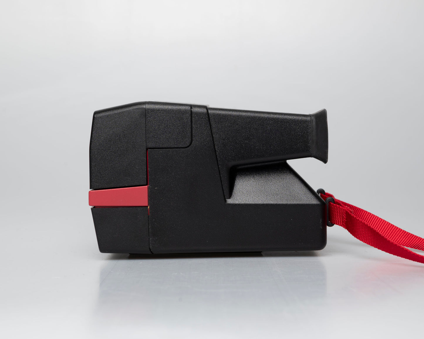 Red Polaroid 600 Cool Cam instant camera (serial F2B0850HVAC)