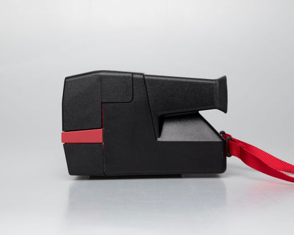 Red Polaroid 600 Cool Cam instant camera (serial F2B0850HVAC)