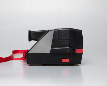 Red Polaroid 600 Cool Cam instant camera (serial F2B0850HVAC)