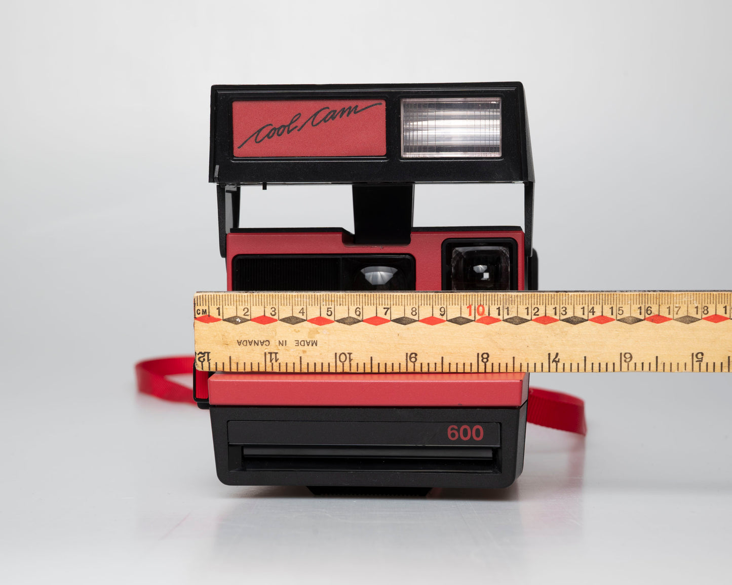 Red Polaroid 600 Cool Cam instant camera (serial F2B0850HVAC)