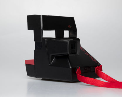 Red Polaroid 600 Cool Cam instant camera (serial F2B0850HVAC)